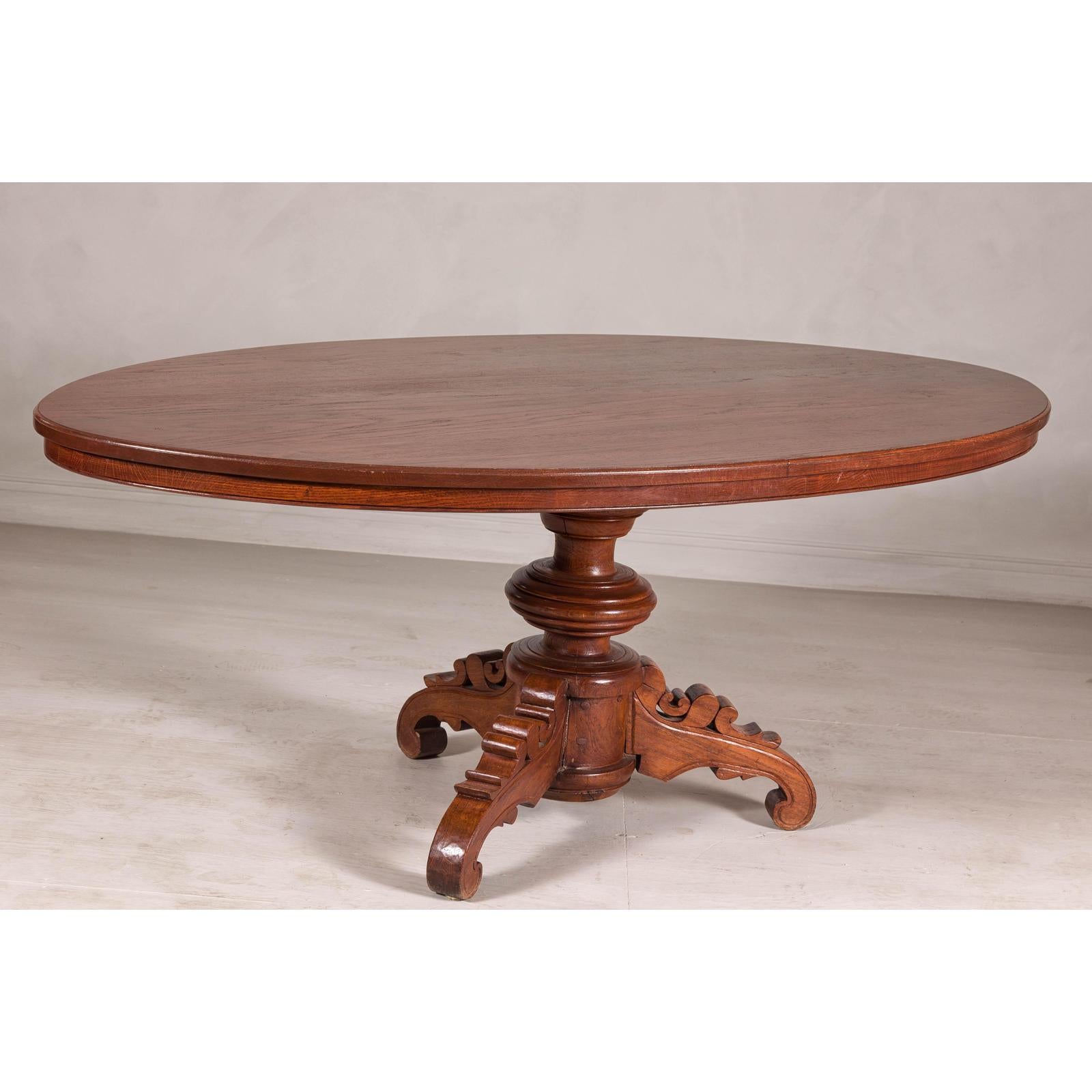 Dutch Colonial Oval Pedestal Dining Table with Scrolling Base, Late 19th Century