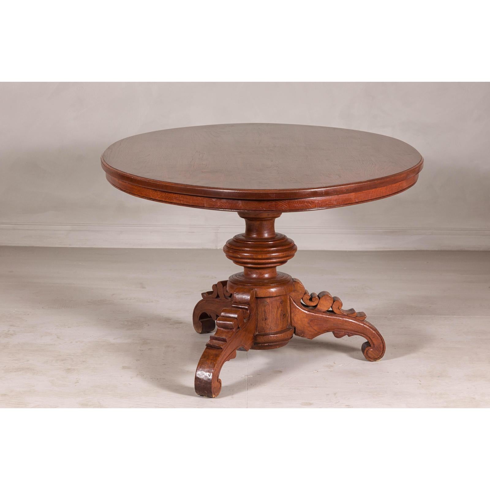 Dutch Colonial Oval Pedestal Dining Table with Scrolling Base, Late 19th Century
