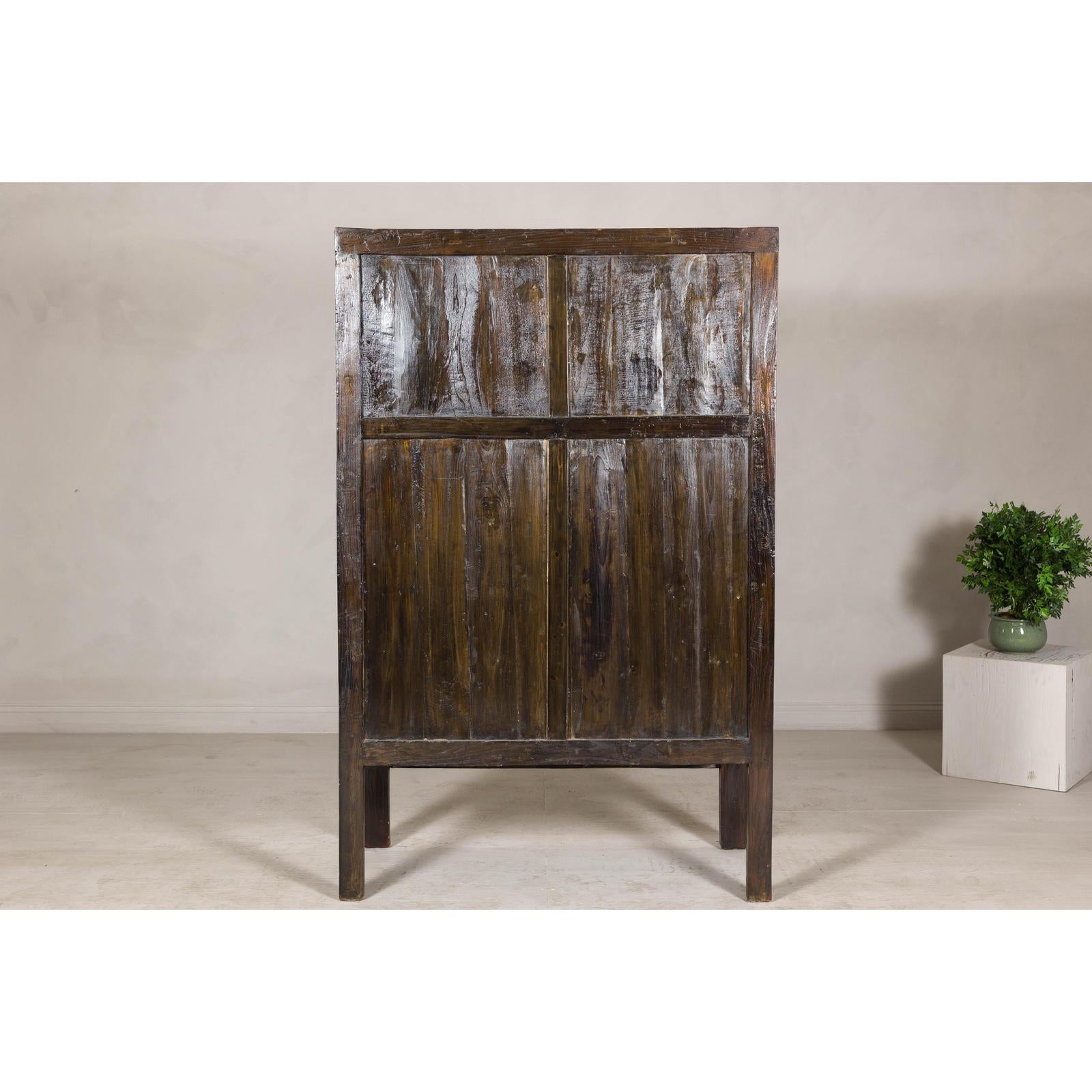 Late Qing Dynasty Black Lacquer Elm Cabinet with Gilt Motifs and Carved Apron