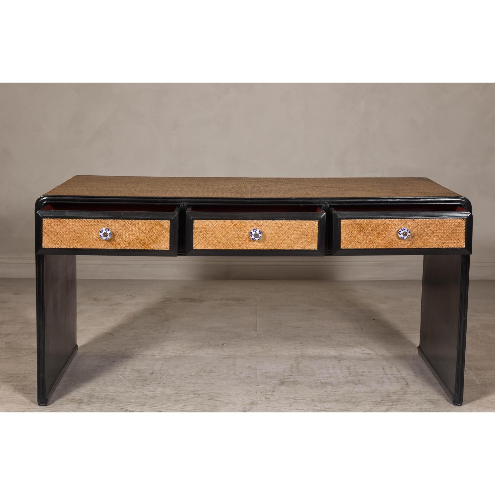 Rattan over Wood Waterfall Desk with Black Lacquer Finish and Three Drawers