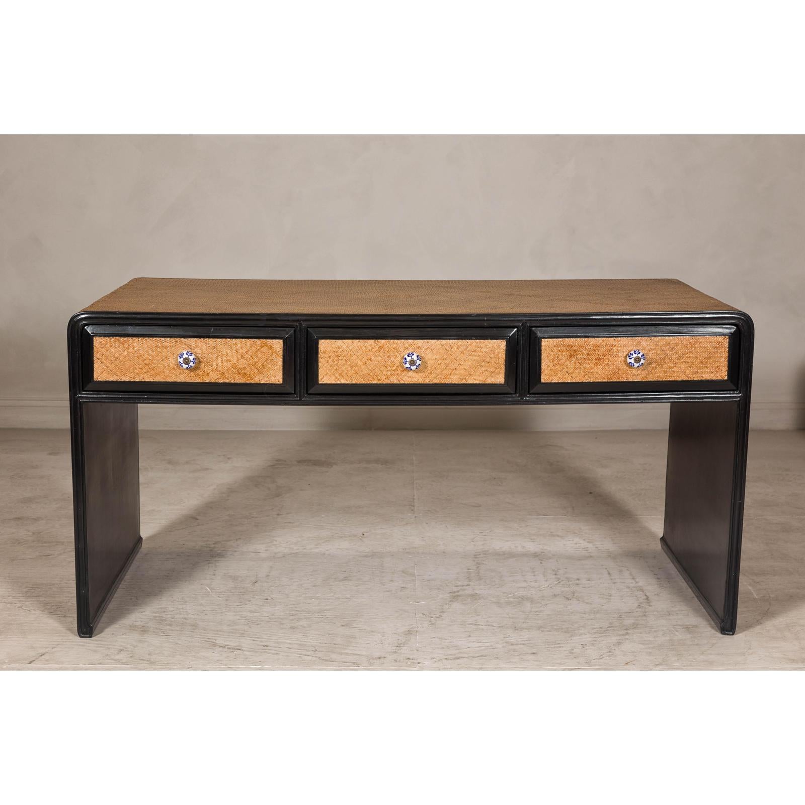Rattan over Wood Waterfall Desk with Black Lacquer Finish and Three Drawers