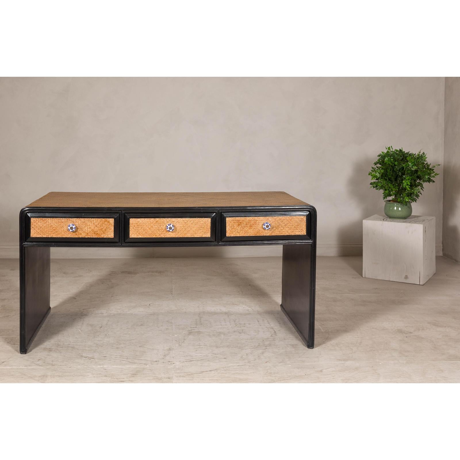 Rattan over Wood Waterfall Desk with Black Lacquer Finish and Three Drawers