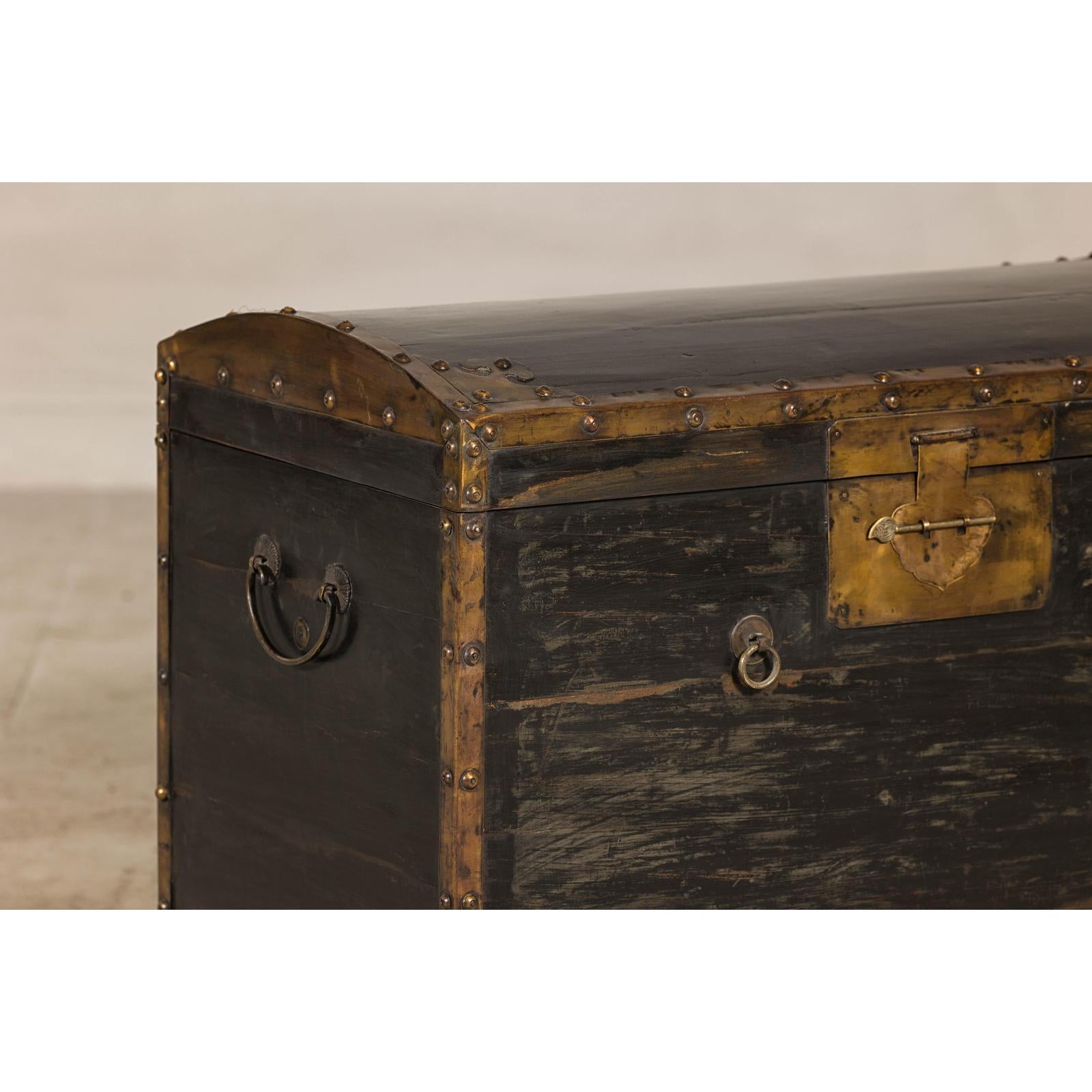 Antique Black and Gold Late Qing Dynasty Trunk with Curved Top and Brass Accents