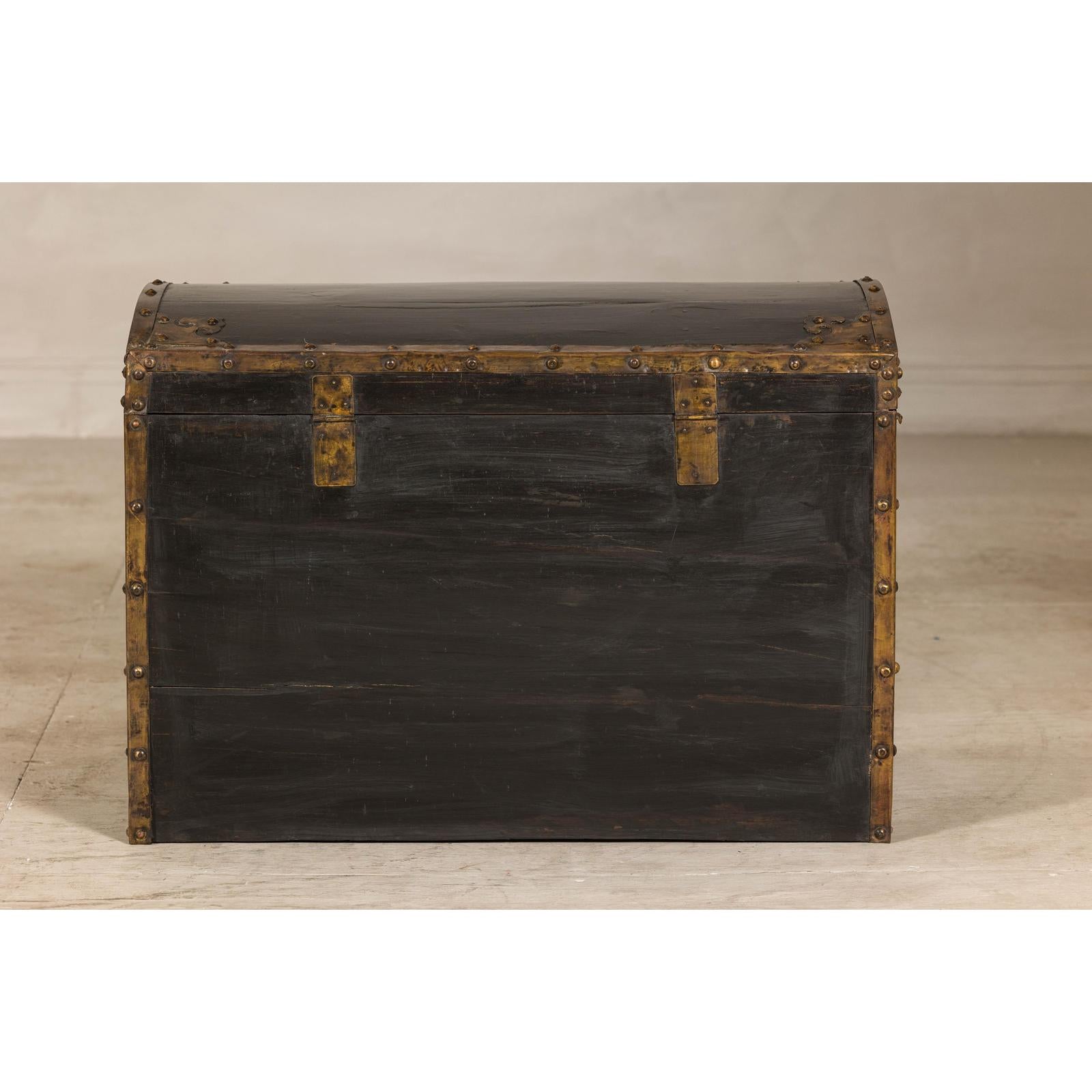 Antique Black and Gold Late Qing Dynasty Trunk with Curved Top and Brass Accents