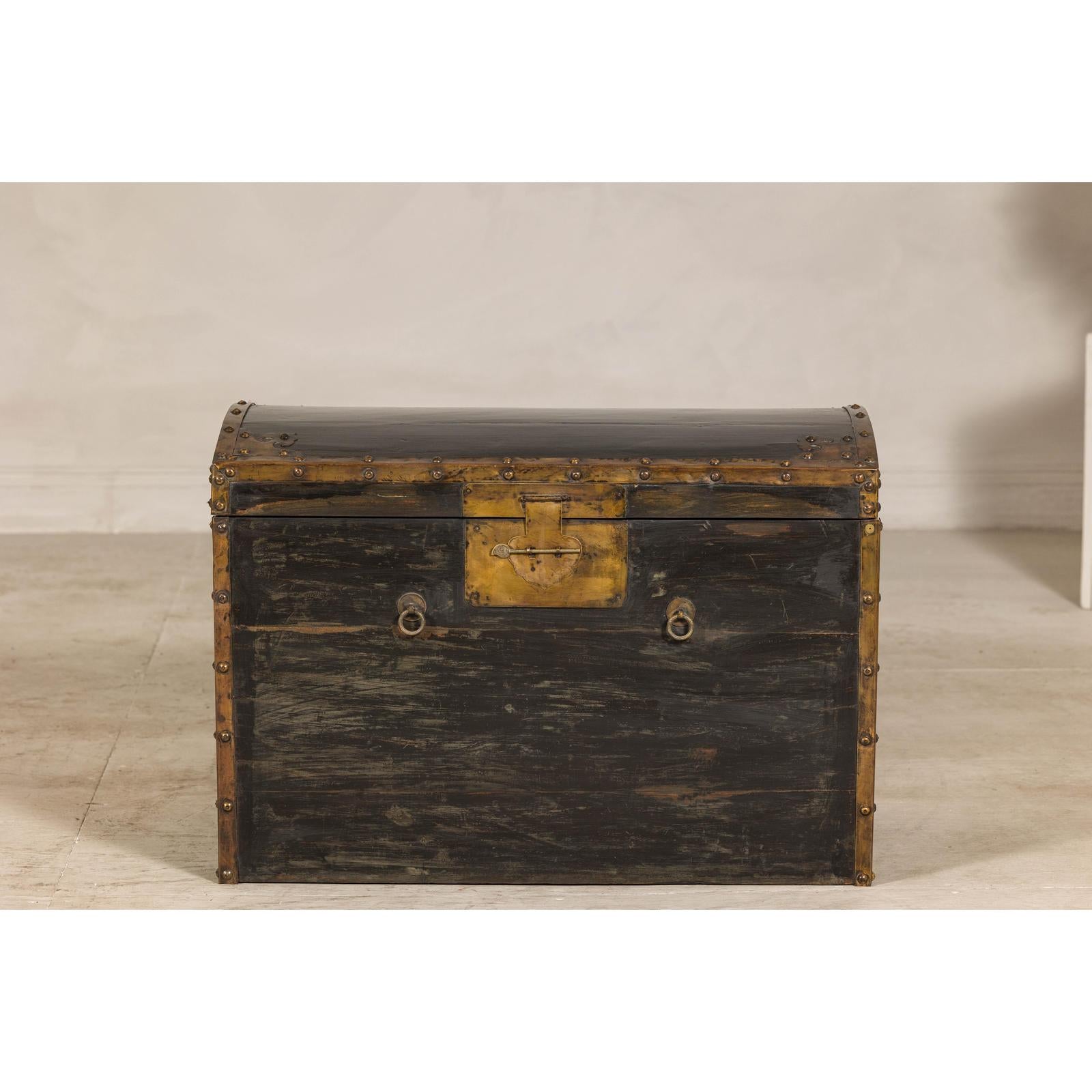 Antique Black and Gold Late Qing Dynasty Trunk with Curved Top and Brass Accents