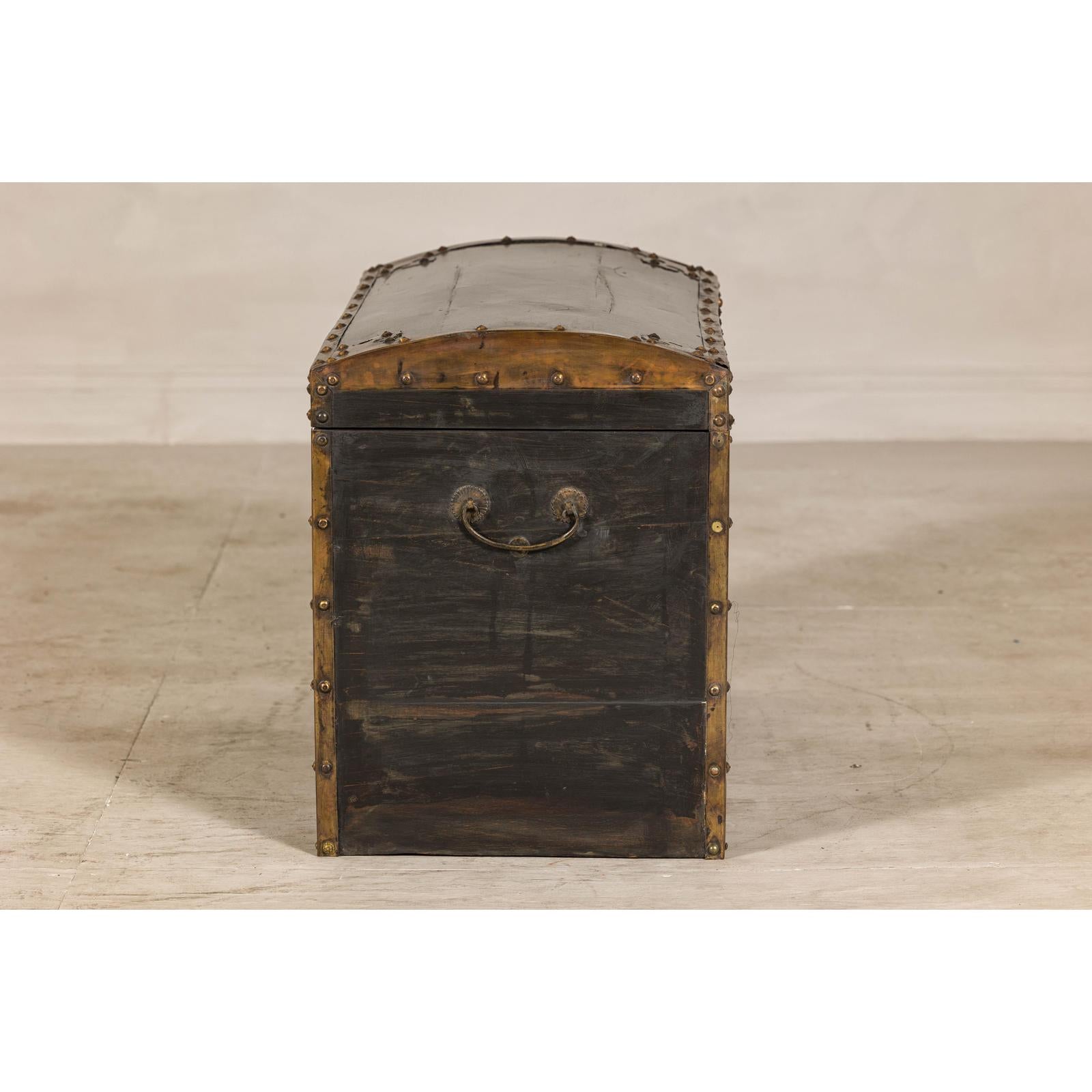Antique Black and Gold Late Qing Dynasty Trunk with Curved Top and Brass Accents