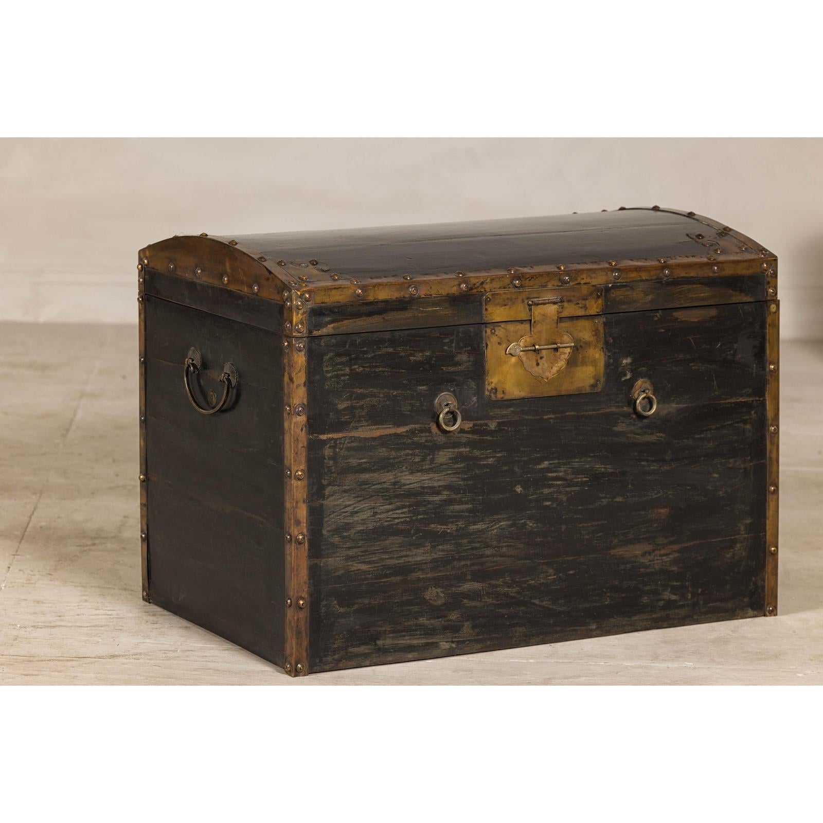 Antique Black and Gold Late Qing Dynasty Trunk with Curved Top and Brass Accents