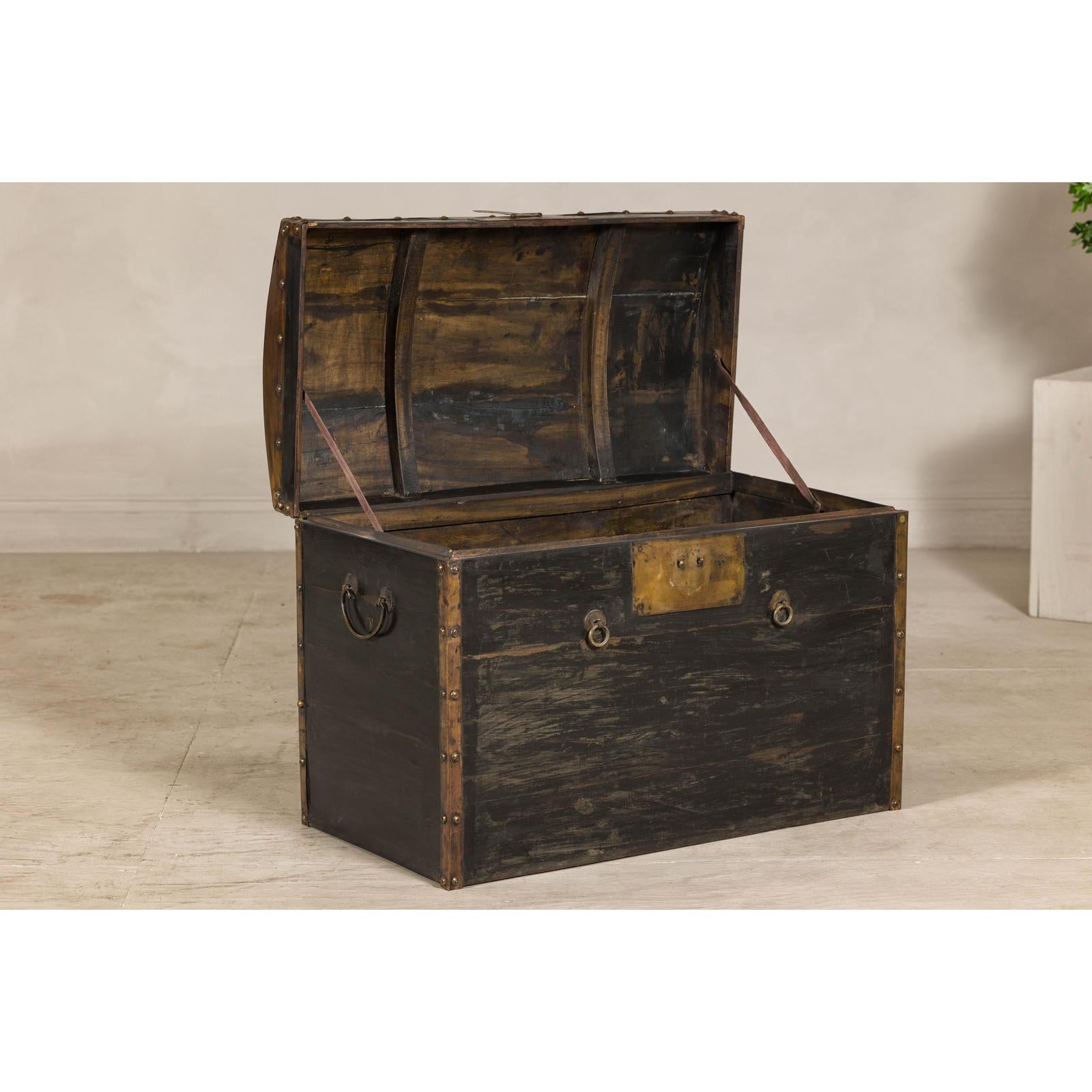 Antique Black and Gold Late Qing Dynasty Trunk with Curved Top and Brass Accents