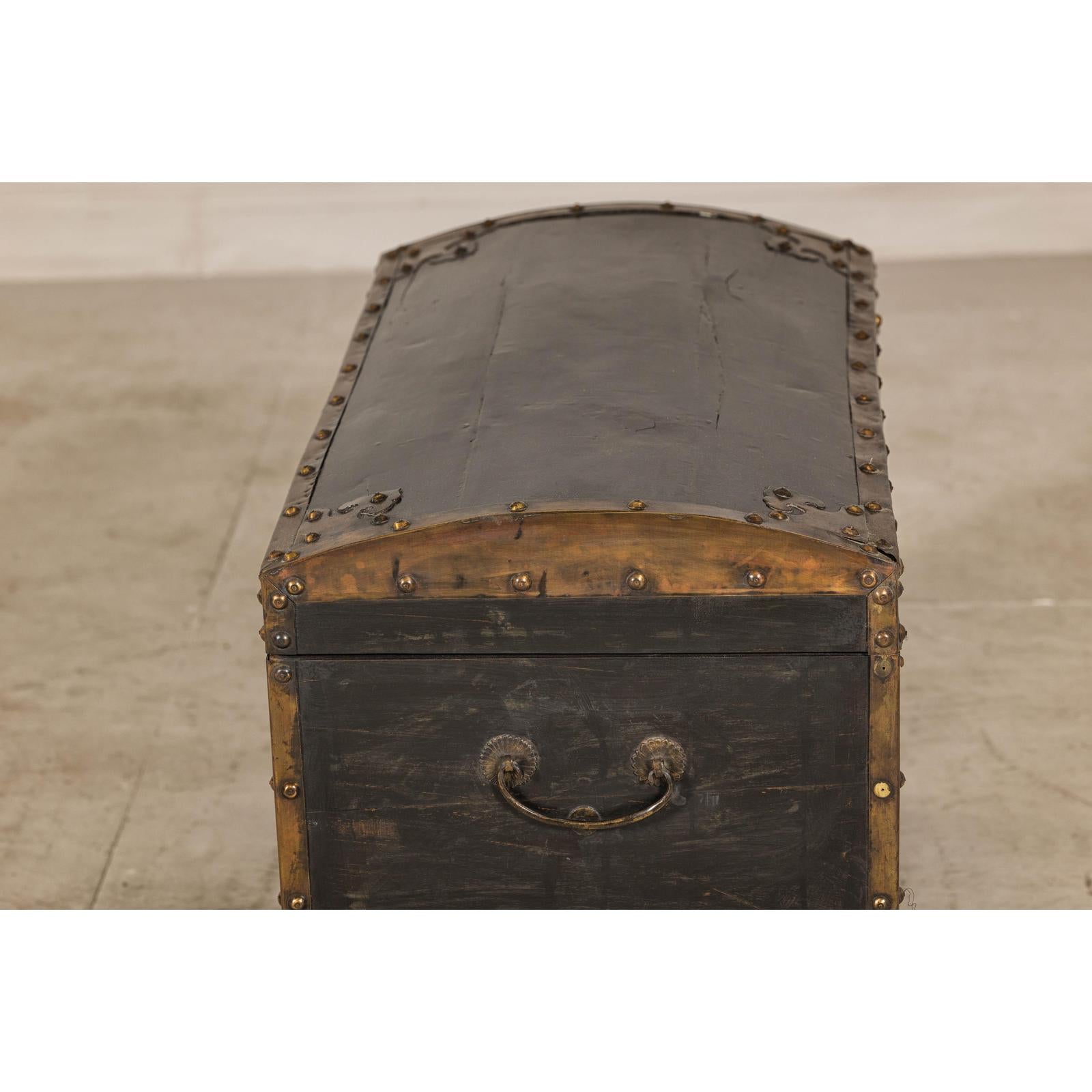 Antique Black and Gold Late Qing Dynasty Trunk with Curved Top and Brass Accents
