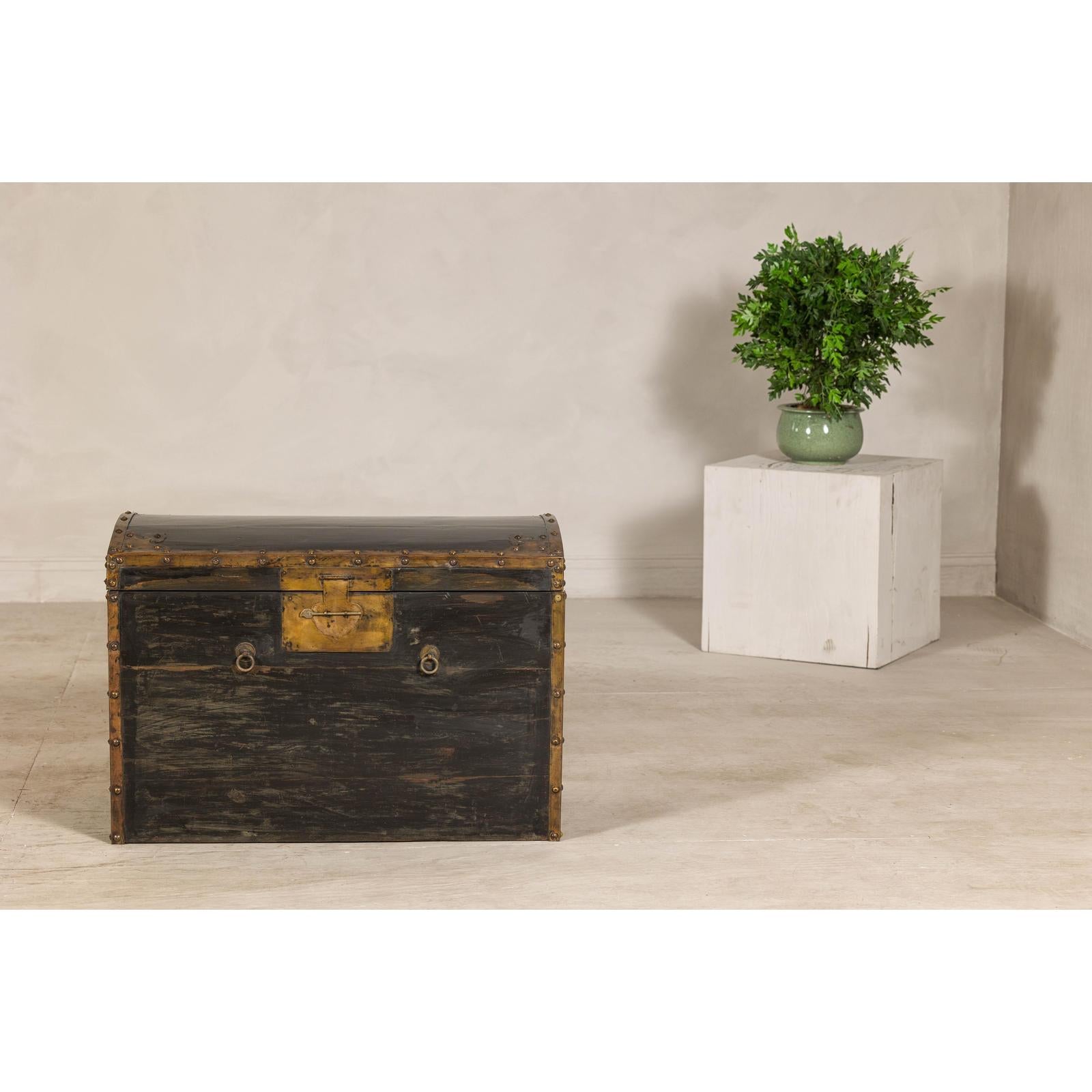 Antique Black and Gold Late Qing Dynasty Trunk with Curved Top and Brass Accents