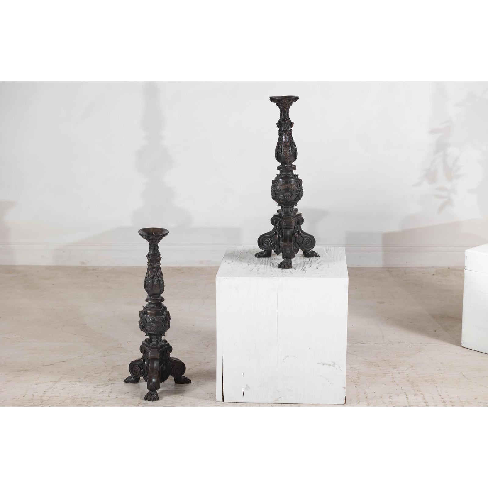 Baroque-Style Ornate Metal Candlesticks with Cherub, Volute and Garland Motifs