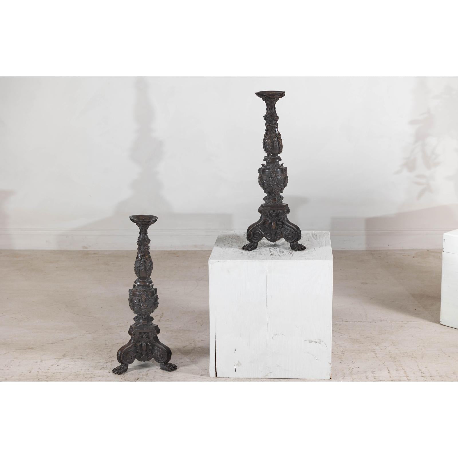 Baroque-Style Ornate Metal Candlesticks with Cherub, Volute and Garland Motifs