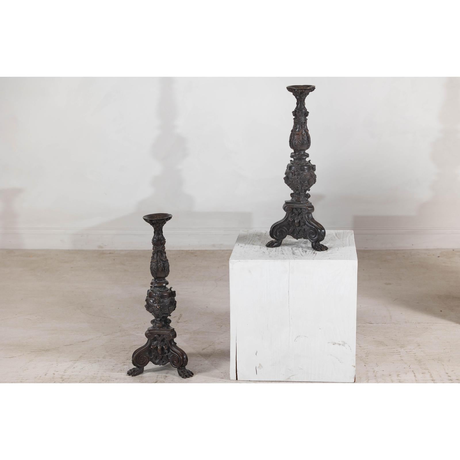 Baroque-Style Ornate Metal Candlesticks with Cherub, Volute and Garland Motifs