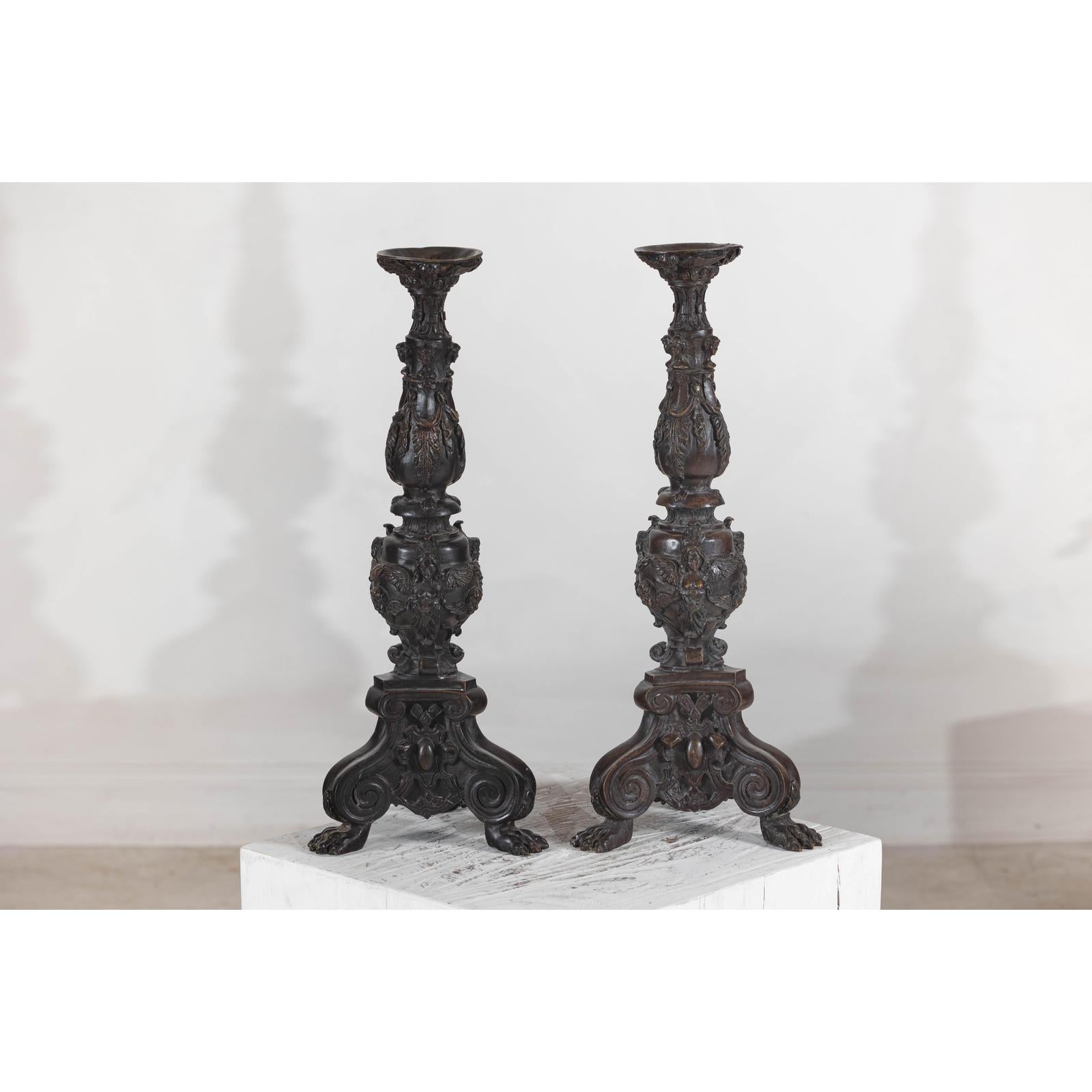 Baroque-Style Ornate Metal Candlesticks with Cherub, Volute and Garland Motifs