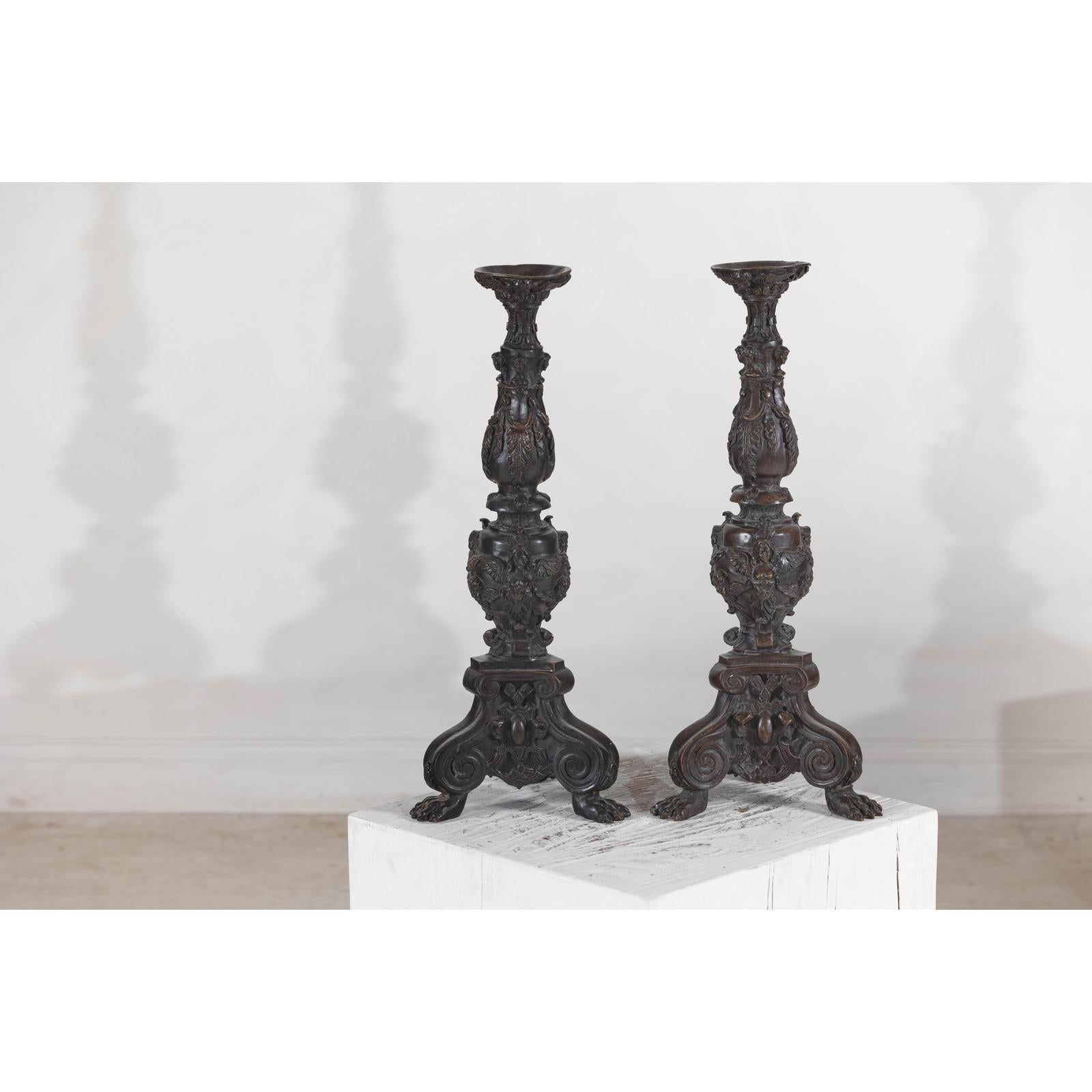 Baroque-Style Ornate Metal Candlesticks with Cherub, Volute and Garland Motifs