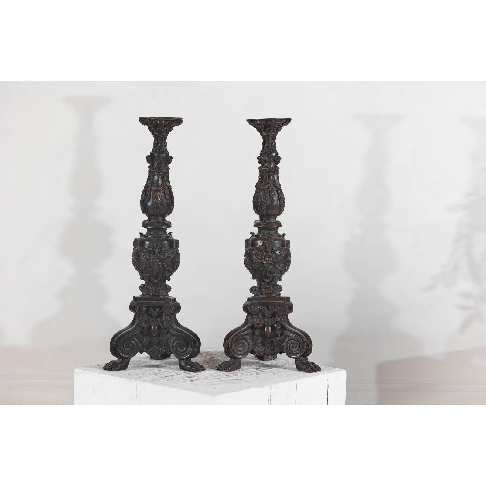 Baroque-Style Ornate Metal Candlesticks with Cherub, Volute and Garland Motifs