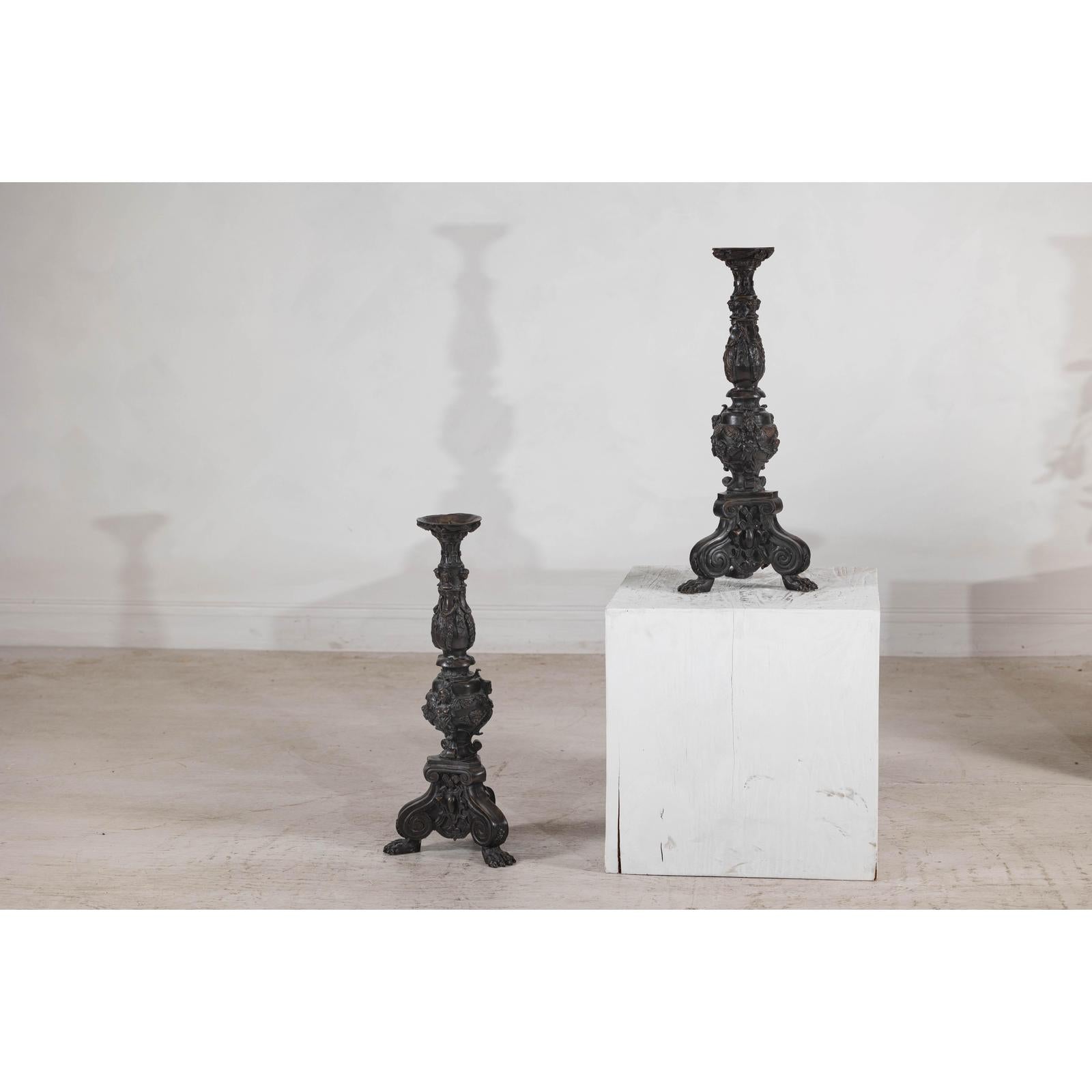 Baroque-Style Ornate Metal Candlesticks with Cherub, Volute and Garland Motifs