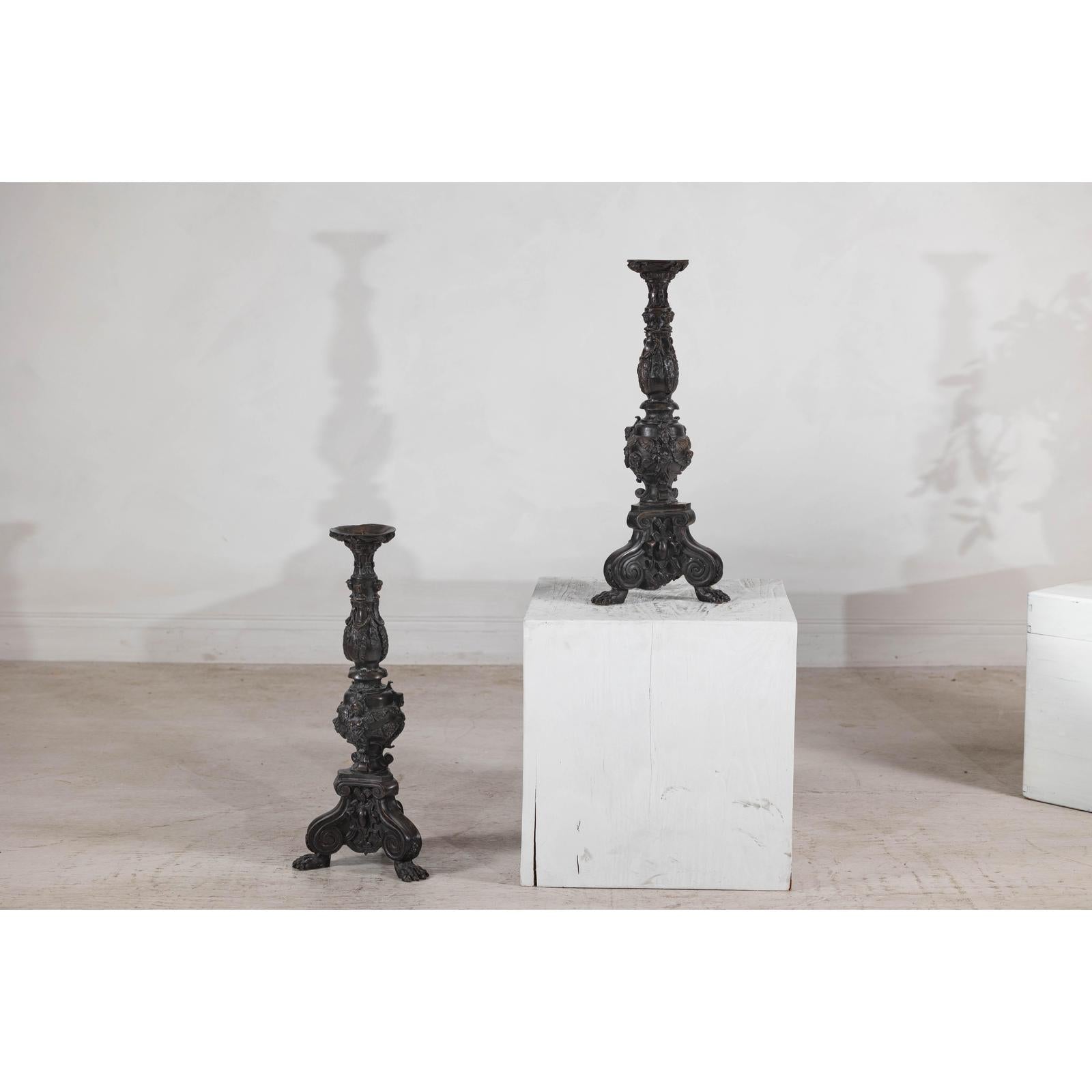 Baroque-Style Ornate Metal Candlesticks with Cherub, Volute and Garland Motifs