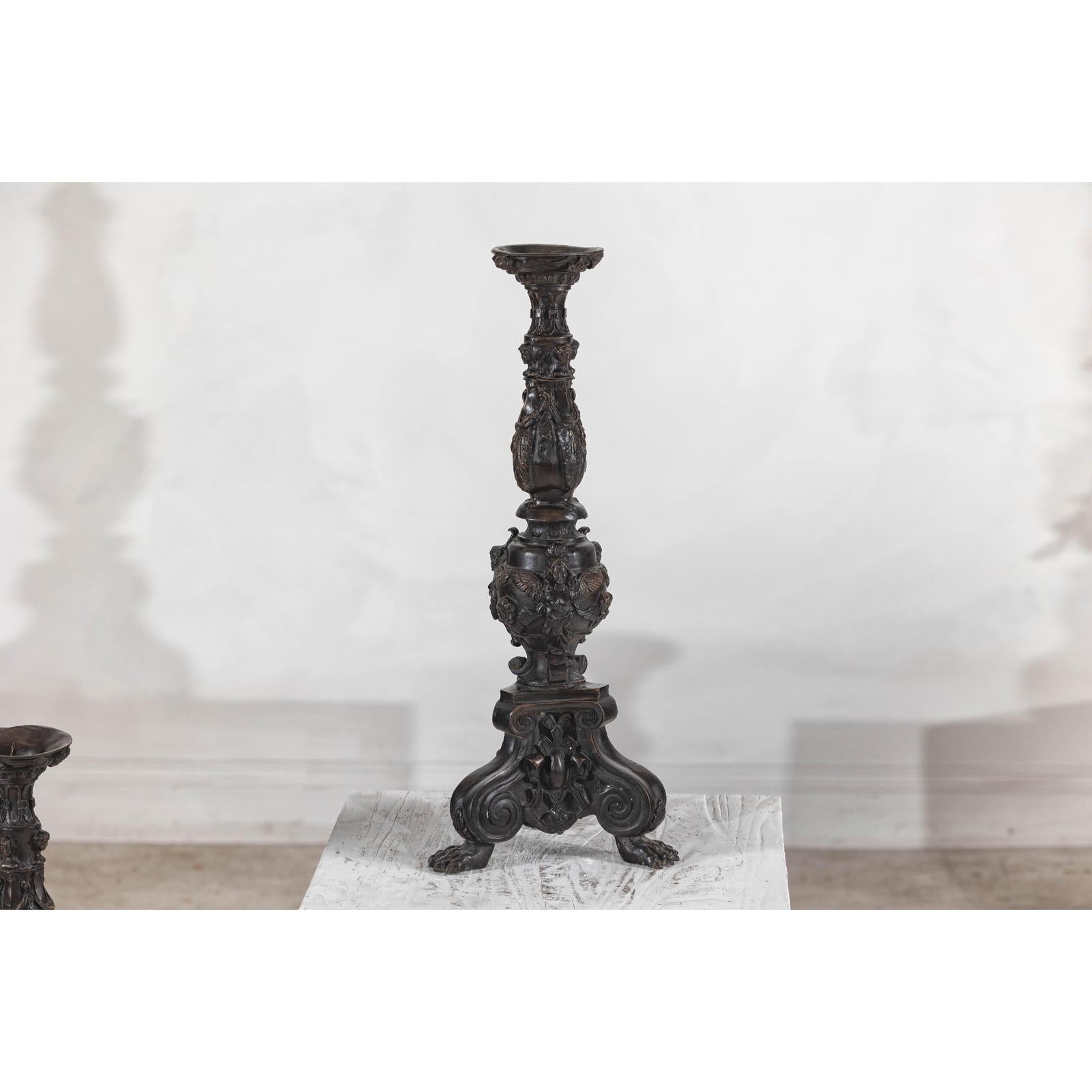 Baroque-Style Ornate Metal Candlesticks with Cherub, Volute and Garland Motifs
