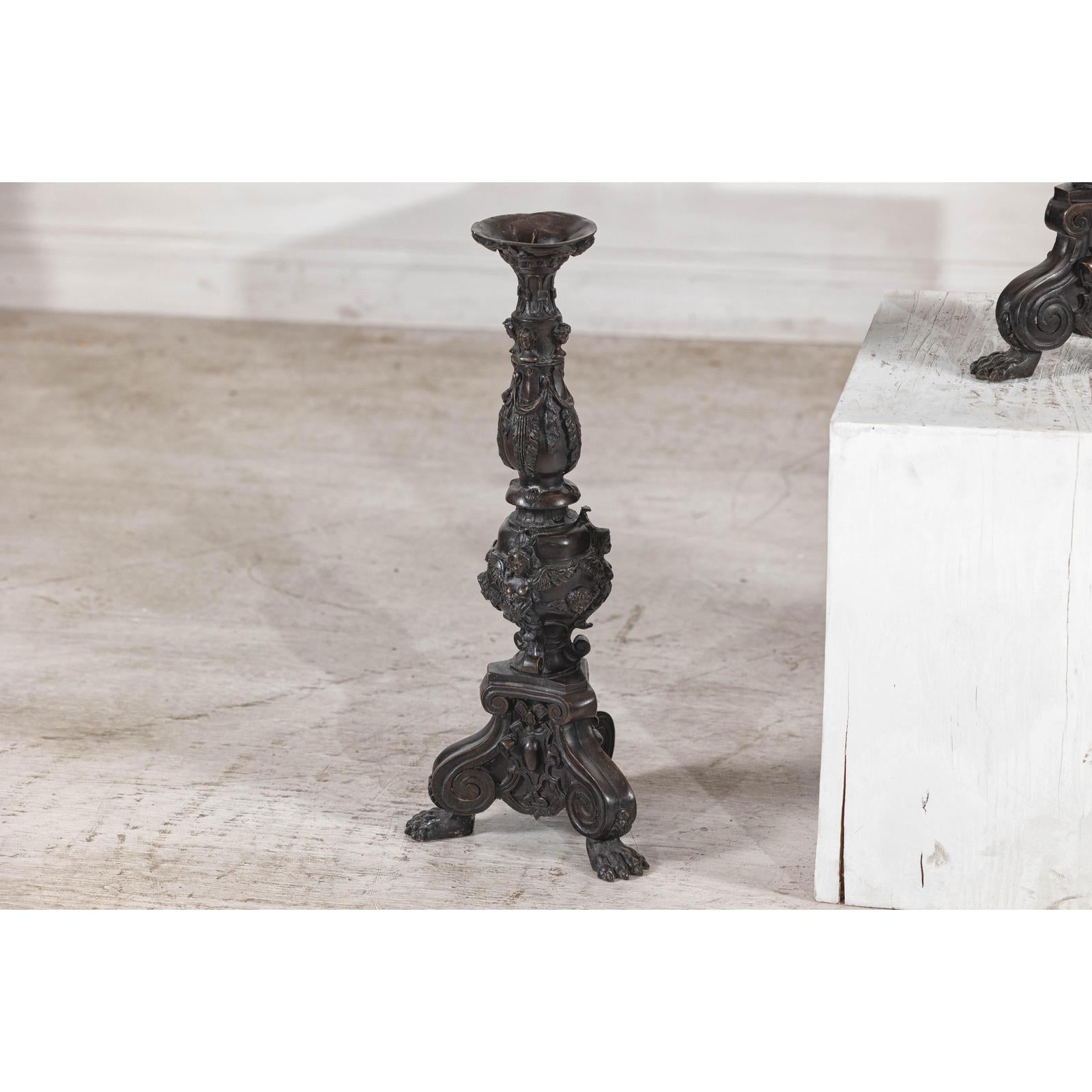 Baroque-Style Ornate Metal Candlesticks with Cherub, Volute and Garland Motifs