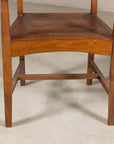 Close-up of teak armchair underside and front stretcher
