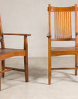 Pair of teak Dutch Colonial armchairs, angled view