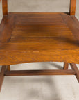 Close-up of solid teak armchair seat