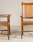 Pair of teak armchairs shown from side and front