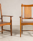 Pair of teak Dutch Colonial chairs, three-quarter views