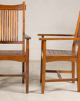 Pair of teak dining armchairs, front and side view