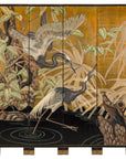Gold-tone painted wood four-panel Chinese screen with cranes, plants, and rocks on decorative surface.