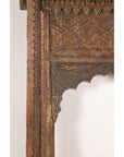 Close-up of carved arch and geometric border