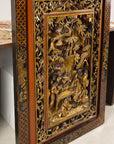 Carved giltwood wall panel, angled left view