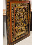 Carved giltwood wall panel, angled left view