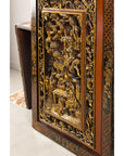 Side view of carved giltwood panel showing deep relief