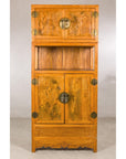 Front view of the tall Chinese cabinet with burlwood panels
