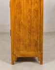 Close-up of a plain elm side panel and lower feet