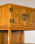 Upper left angled view of burlwood doors and open shelf