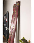 Full view of paired red Chinese wood panels with vertical gilt calligraphy