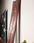Full view of paired red Chinese wood panels with vertical gilt calligraphy