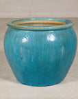 Turquoise glazed stoneware planter front view
