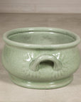 Front view of the celadon footbath centered on one loop handle