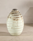Cream-glazed artisan ceramic vase with brown horizontal bands.