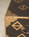 Close-up of lacquered chest corner and carrying handle