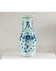 Blue and white porcelain Chinese vase with painted scenes, celadon glaze, and decorative handles, close-up view.