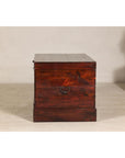 Antique Reddish Brown Lacquered Elm Trunk with Brass Lock and Raised Base
