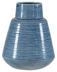 Close-up of blue-glazed ceramic vase with wide base, narrow neck, and textured horizontal lines.