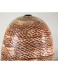 Neutral-tone ceramic vase with snakeskin textured glaze, close-up against a plain background.