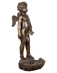 Dark patina bronze cherub statue with wings standing on a shell, lost wax style, close-up.