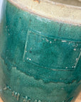 Round Green Glazed Ceramic Jar with Chinese Markings - FEA Home